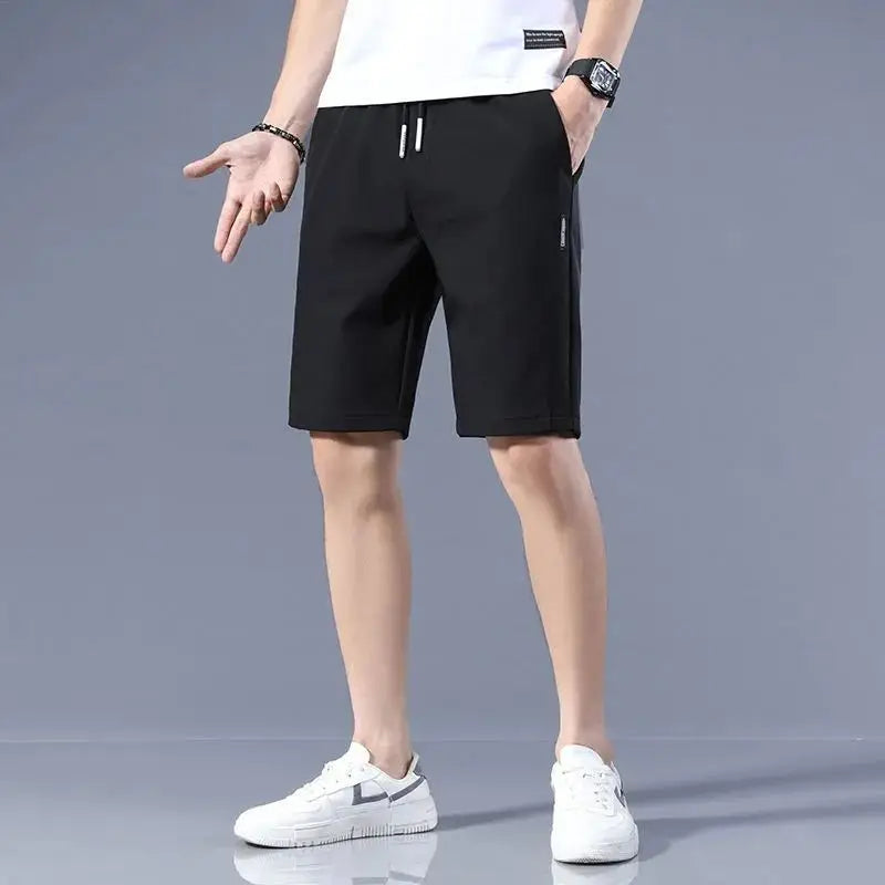 High Quality Polyester Ice Silk Shorts Men 2024 New Korean Version Of Loose Elastic Splicing Beach Five Minute Medium Pants